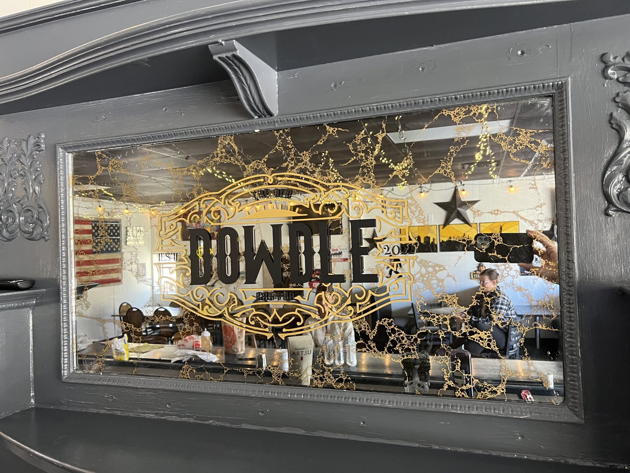 The etched Dowdle Pub and Grub mirror inside the pub